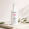 Flacon Silky Detangling Spray Long Hair La Biosthétique posé sur une pierre claire